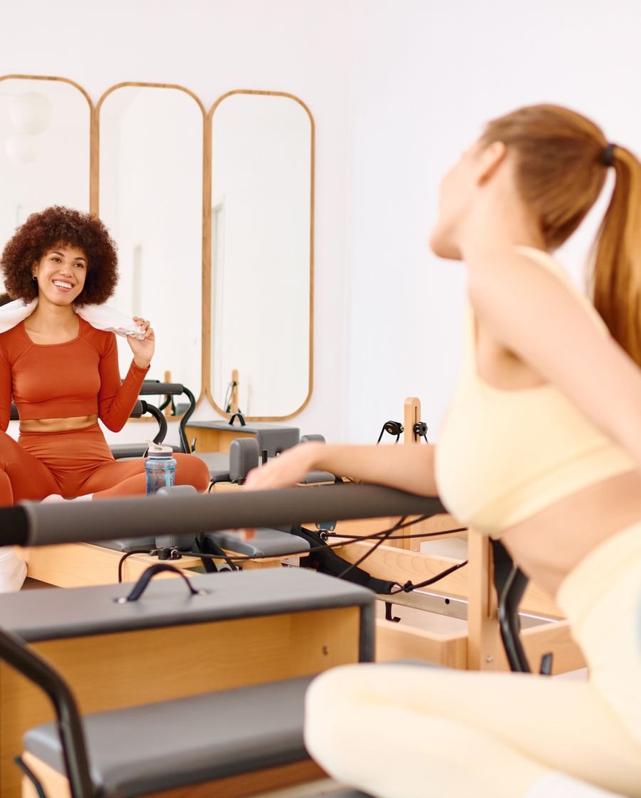 Client smiling on the Reformer